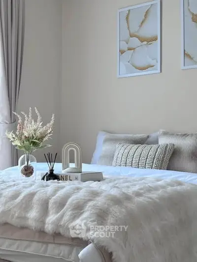Cozy bedroom with elegant decor and plush bedding, perfect for relaxation.