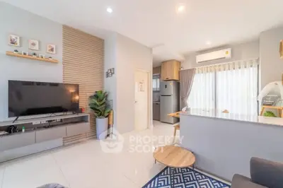 Modern living room with open kitchen and stylish decor