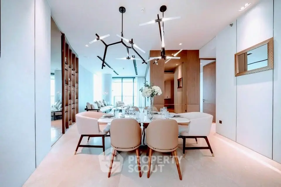Luxurious modern dining room with elegant lighting and spacious seating in a high-end apartment.