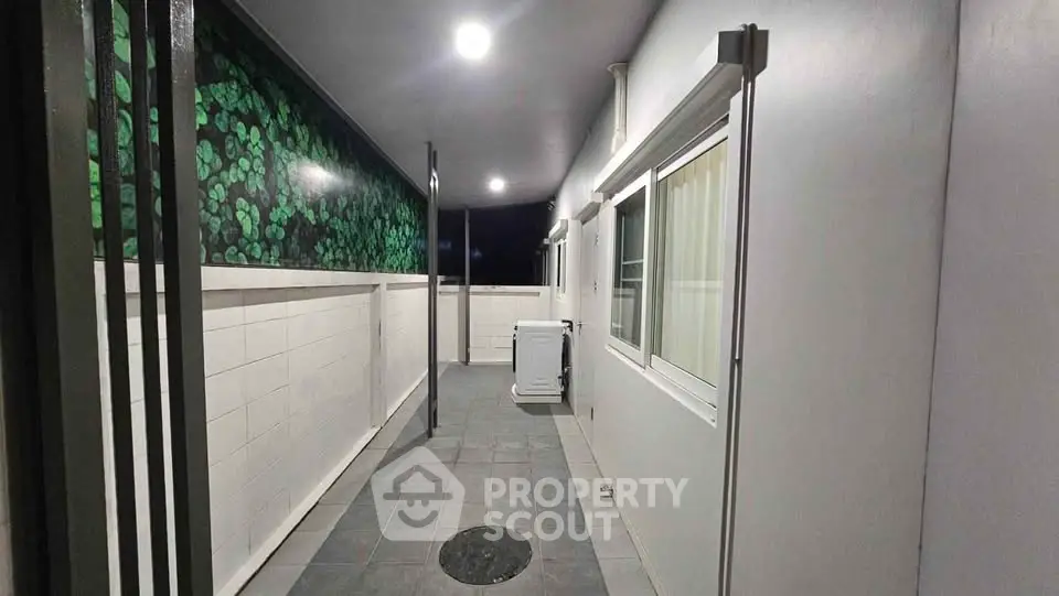Modern apartment corridor with sleek design and ambient lighting