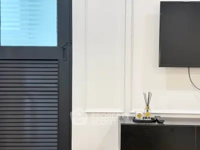 Modern living room with sleek TV setup and stylish decor