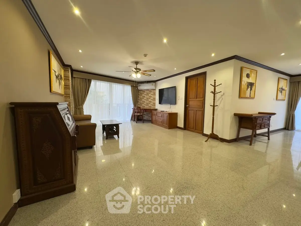 Spacious living room with elegant decor and natural light