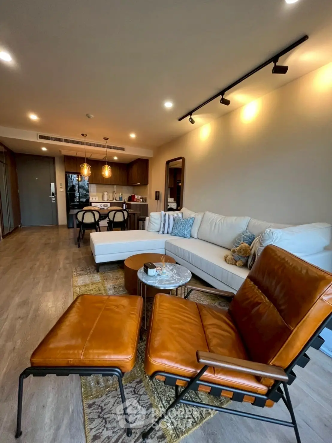 Stylish open-layout living room with modern furniture and cozy ambiance