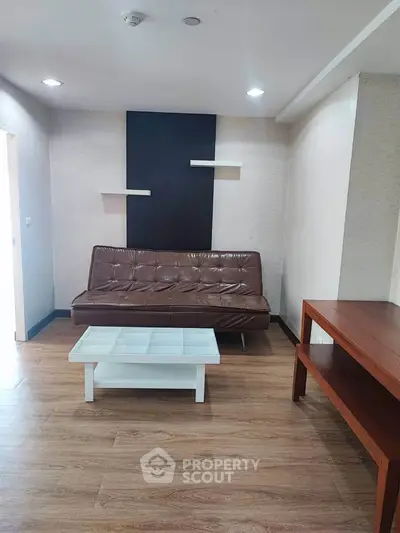 Modern living room with stylish sofa and coffee table in cozy apartment