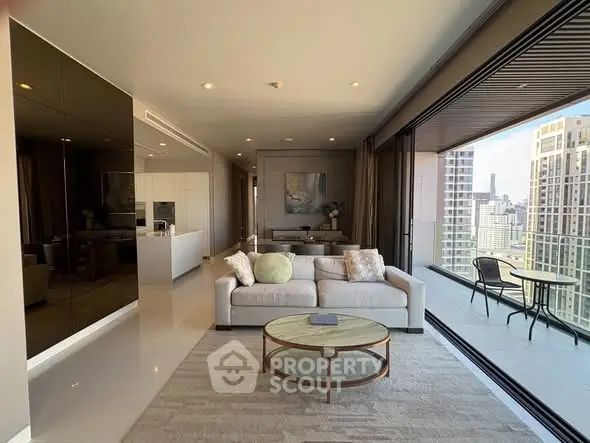 Luxurious living room with expansive city view and spacious balcony in modern high-rise apartment.