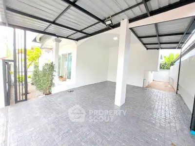 Spacious covered parking area with modern design and tiled flooring