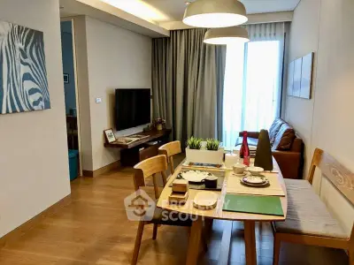 Modern living room with dining area, wooden furniture, and natural light.