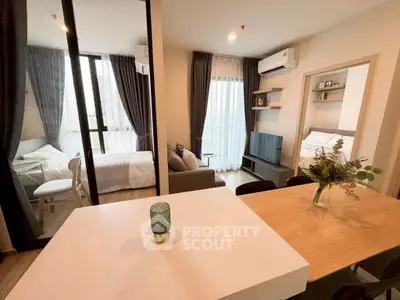 Modern open-plan living room with cozy bedroom and stylish decor