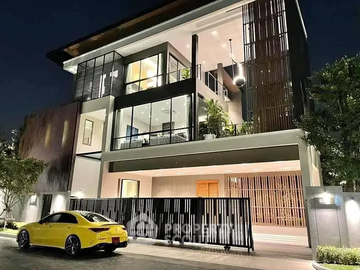 Luxurious modern house with sleek architecture and stylish yellow car at night