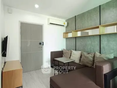 Modern living room with stylish decor and comfortable seating in a contemporary apartment.