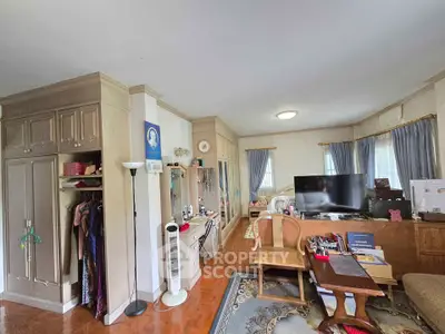 Spacious living room with elegant decor and large TV setup