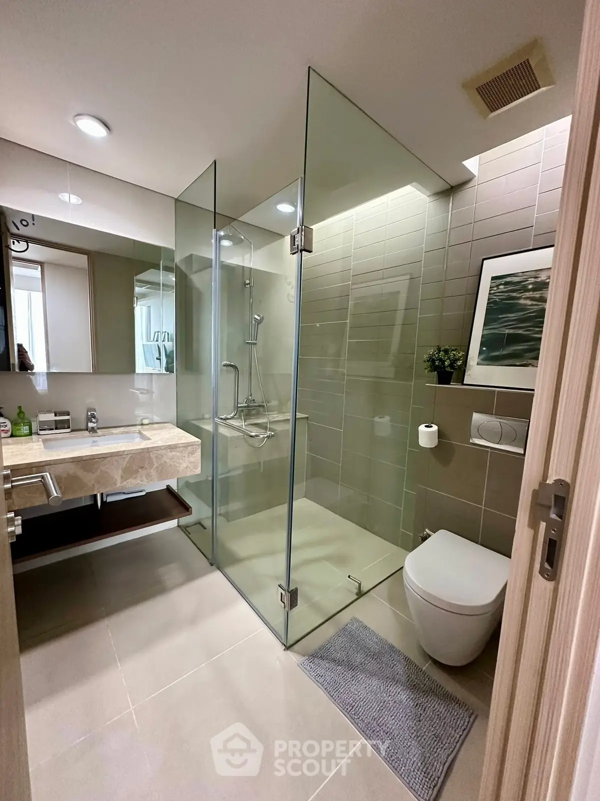 Modern bathroom with glass shower and elegant fixtures