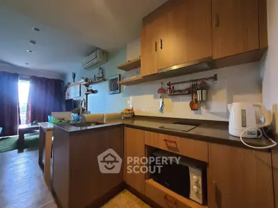 Modern kitchen with wooden cabinets and open layout in cozy apartment