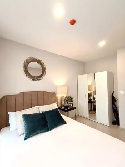 Modern bedroom with stylish decor and ample storage space