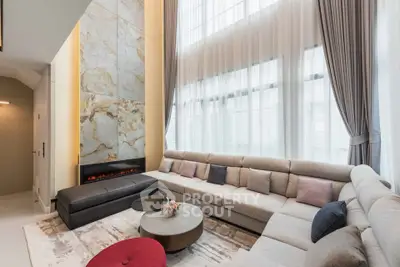 Luxurious modern living room with high ceilings and elegant decor