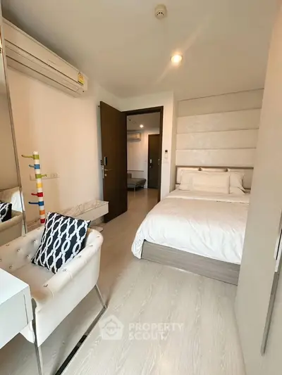 Cozy modern bedroom with stylish decor and natural light