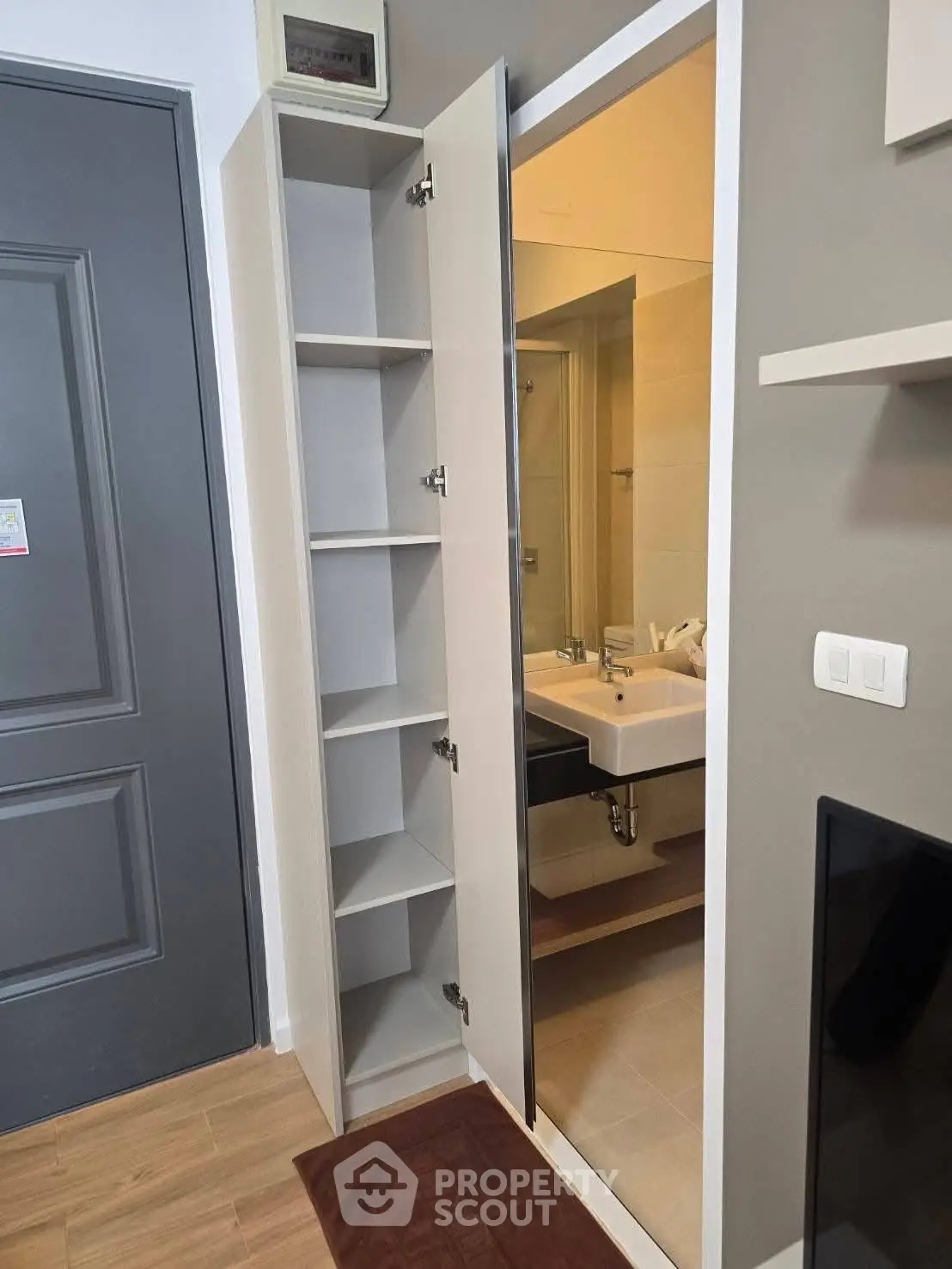 Modern bathroom with sleek storage cabinet and stylish sink area