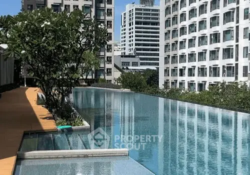 Luxurious rooftop pool with stunning cityscape views in modern urban setting.