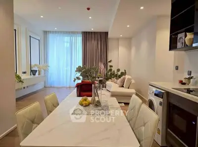 Stylish modern living room with open dining area and elegant decor