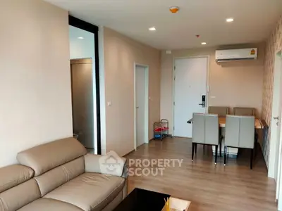 Modern living room with dining area and air conditioning in stylish apartment