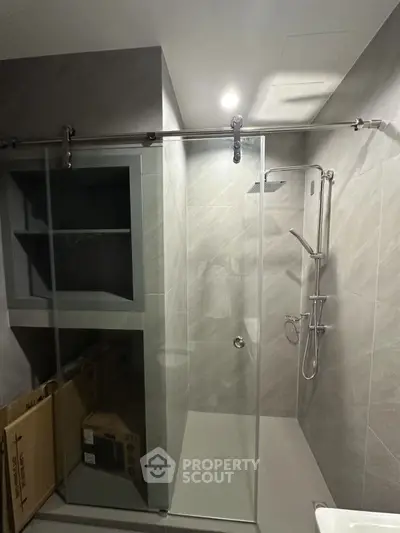 Modern bathroom with sleek shower and built-in storage