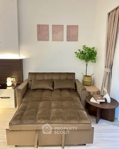 Cozy living room with stylish brown sofa bed and modern decor