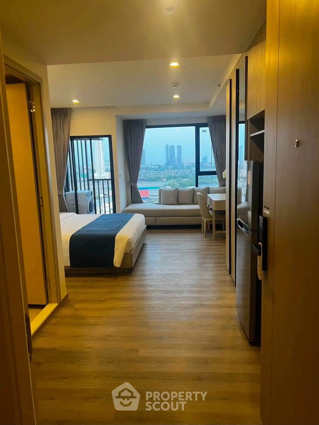 Modern studio apartment with stunning city view and elegant interior design.