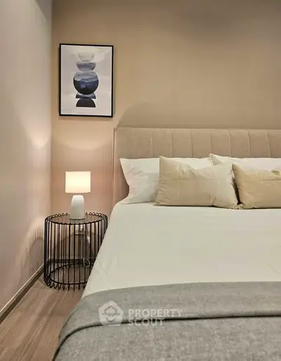Cozy bedroom with modern decor and stylish bedside lamp