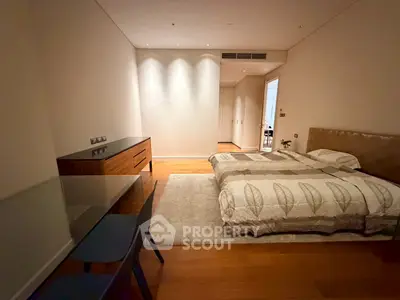 Spacious modern bedroom with elegant decor and cozy ambiance