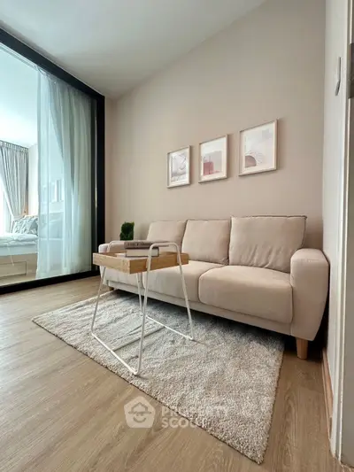 Modern living room with cozy beige sofa and stylish decor in a bright apartment.