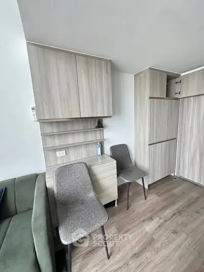 Modern living room with stylish furniture and wooden flooring