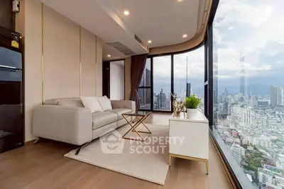 Luxurious corner unit living room with panoramic city view and modern decor.