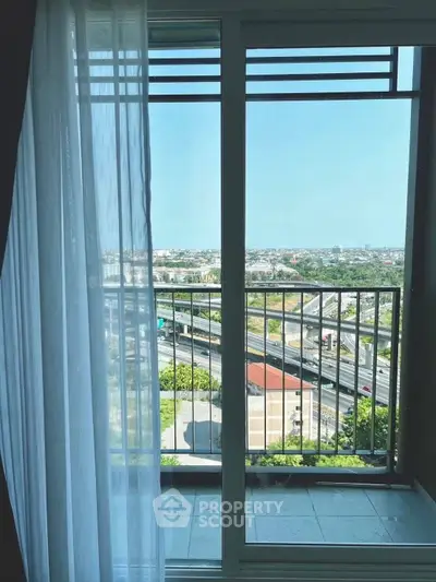 Stunning balcony view with expansive cityscape and lush greenery, perfect for relaxation and enjoying the outdoors.