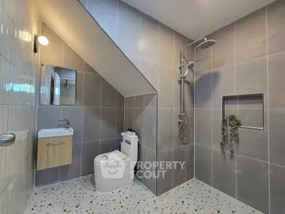 Modern bathroom with sleek design and spacious shower area