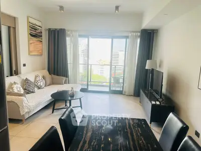 Modern living room with balcony view in high-rise apartment