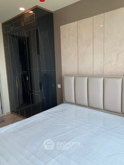 Modern bedroom with elegant design and built-in wardrobe
