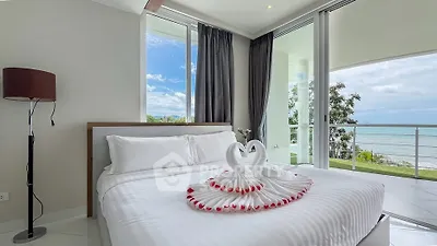 Luxurious bedroom with ocean view and elegant decor, perfect for a serene retreat.