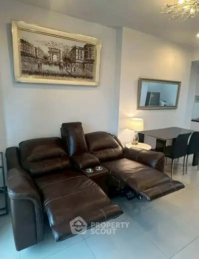 Modern living room with leather recliner and elegant decor