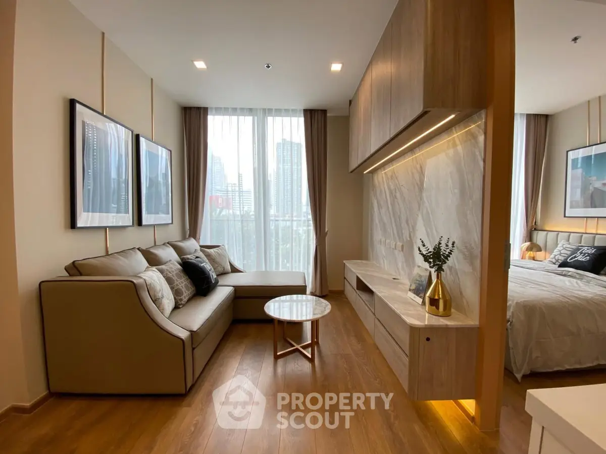Modern living room with elegant decor and city view, featuring a cozy sofa and stylish wooden accents.