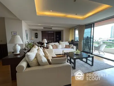 Luxurious living room with elegant decor and spacious balcony view