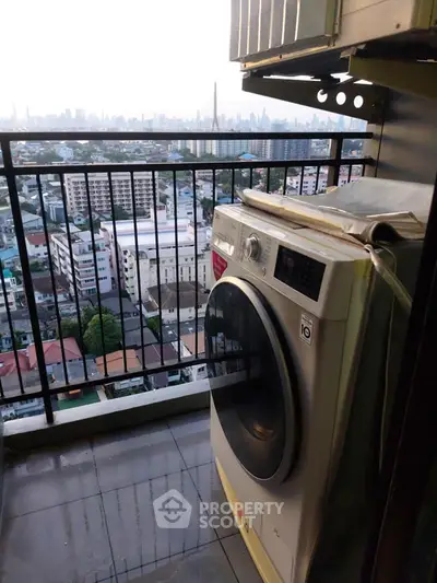 High-rise balcony with washing machine and stunning cityscape view