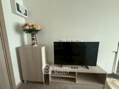 Modern living room with sleek TV stand and elegant floral decor