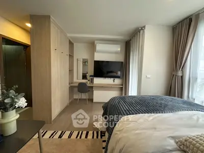 Modern bedroom with stylish decor, featuring a cozy bed, study desk, and ample natural light.