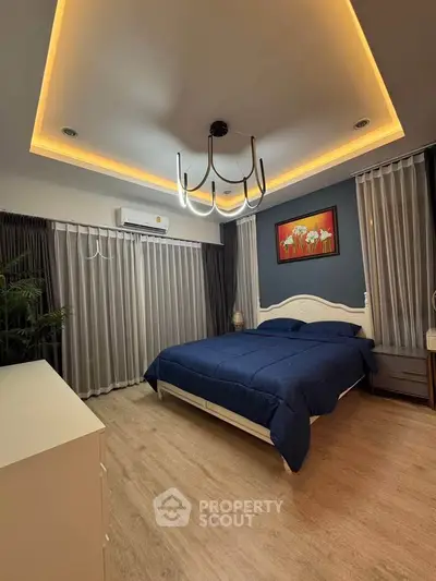 Luxurious bedroom with modern lighting and elegant decor