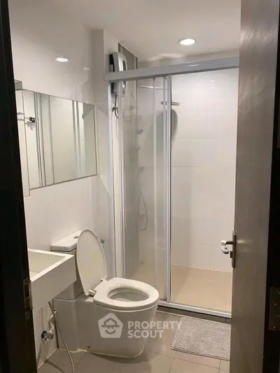 Modern bathroom with glass shower and sleek fixtures