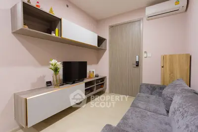 Modern cozy living room with sleek furniture and wall-mounted TV