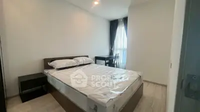 Modern bedroom with natural light and minimalist furniture