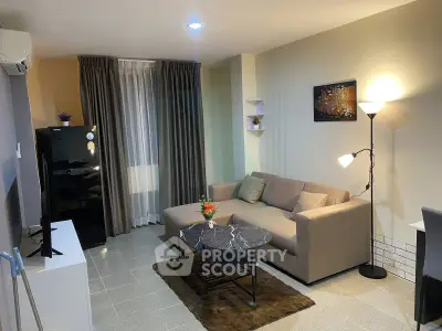 Modern living room with stylish decor and comfortable seating in a cozy apartment.