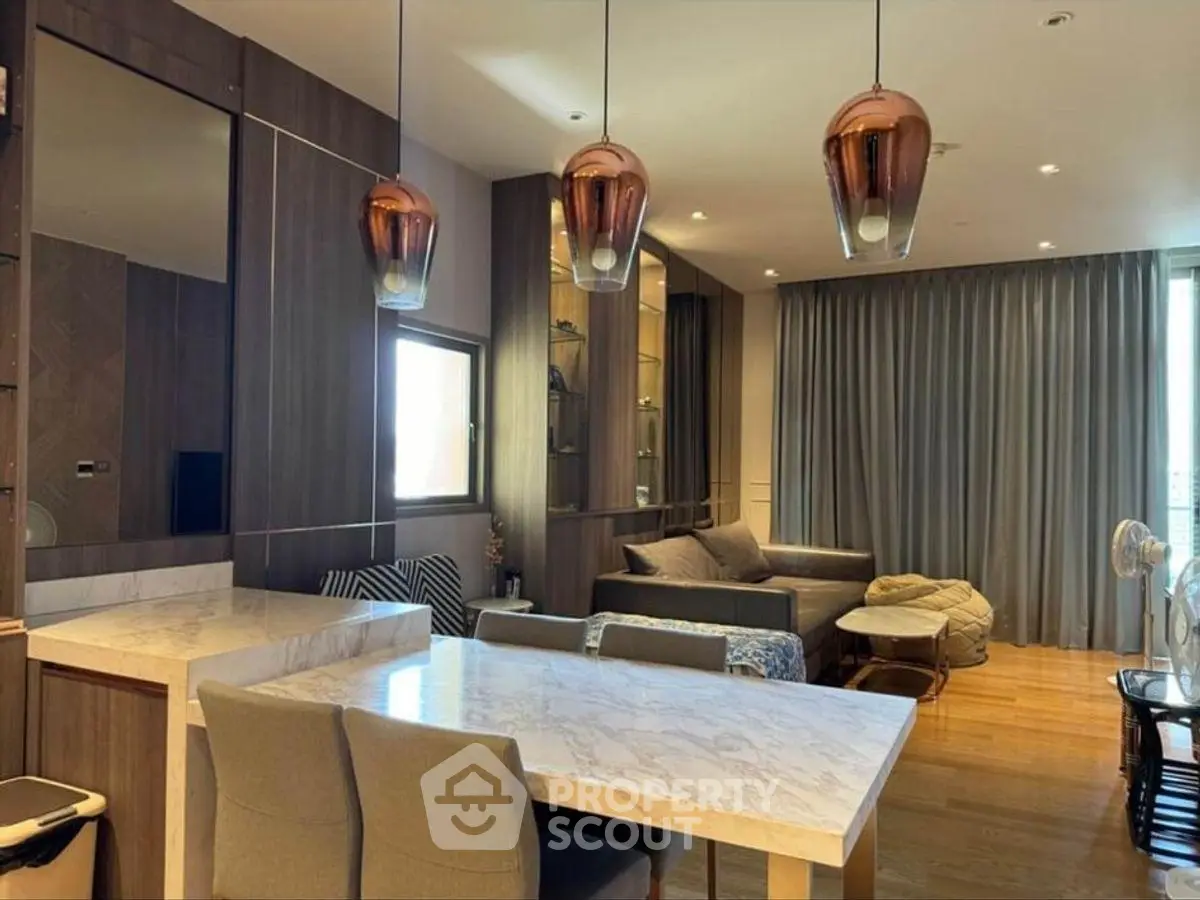 Luxurious modern living room with elegant lighting and marble dining table