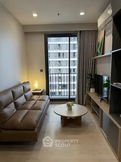 Modern living room with brown leather sofa and city view balcony